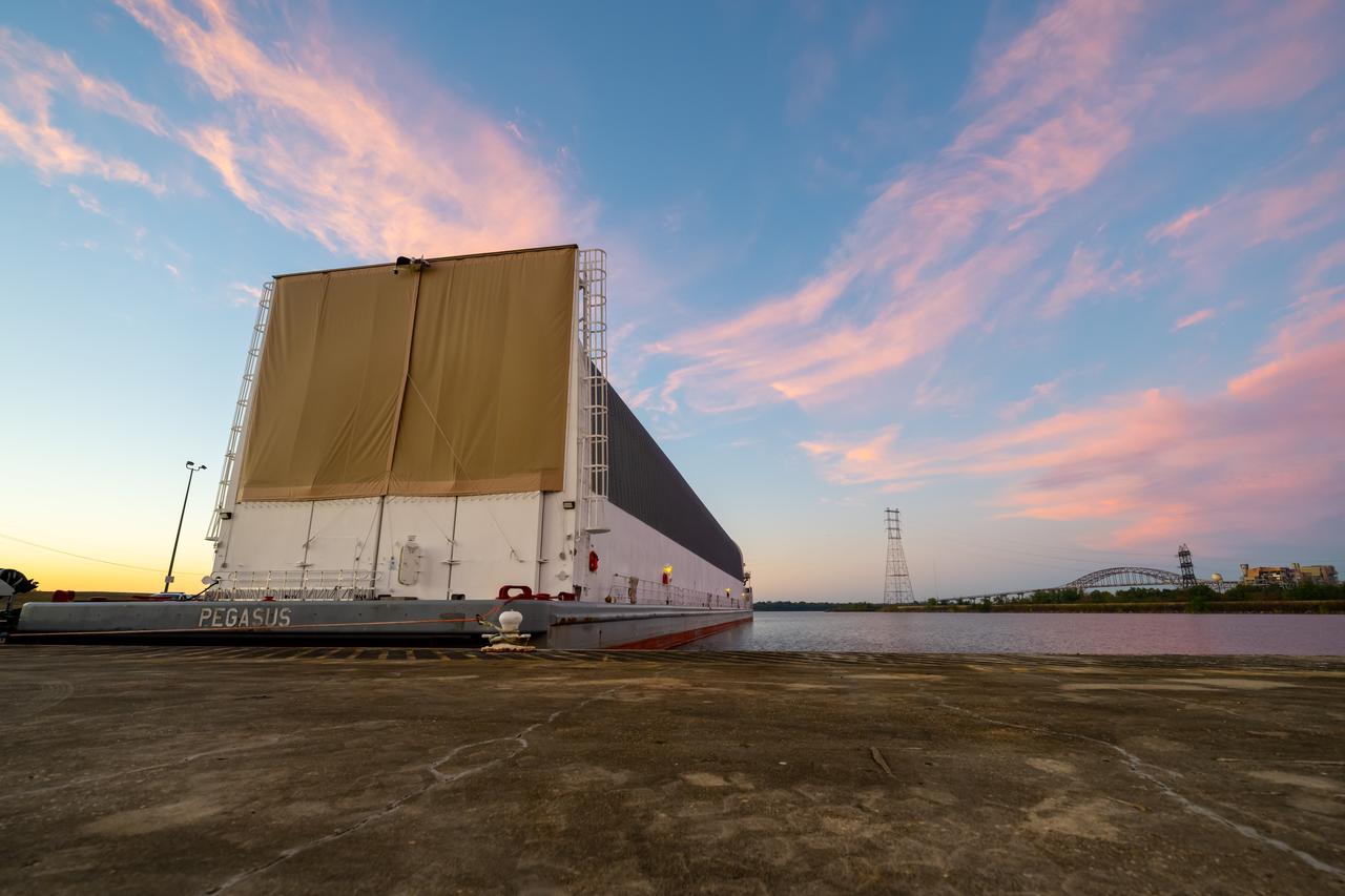 Teams at NASA’s Michoud Assembly Facility in New Orleans move the engine section flight hardware to the agency’s Pegasus barge Sunday, Dec. 4. The barge will ferry the engine section of NASA’s Space Launch System (SLS) rocket for Artemis III to the agency’s Kennedy Space Center in Florida. Once there, teams at Kennedy will finish outfitting the engine section, which comprises the tail-end of the rocket’s 212-foot-tall core stage, before integrating it to the rest of the stage. Beginning with production for Artemis III, NASA and core stage lead contractor Boeing will use Michoud, where the SLS core stages are currently manufactured, to produce and outfit the core stage’s five elements, and available space at Kennedy for final assembly and integration. Photo Credit: (NASA/Jared Lyons)